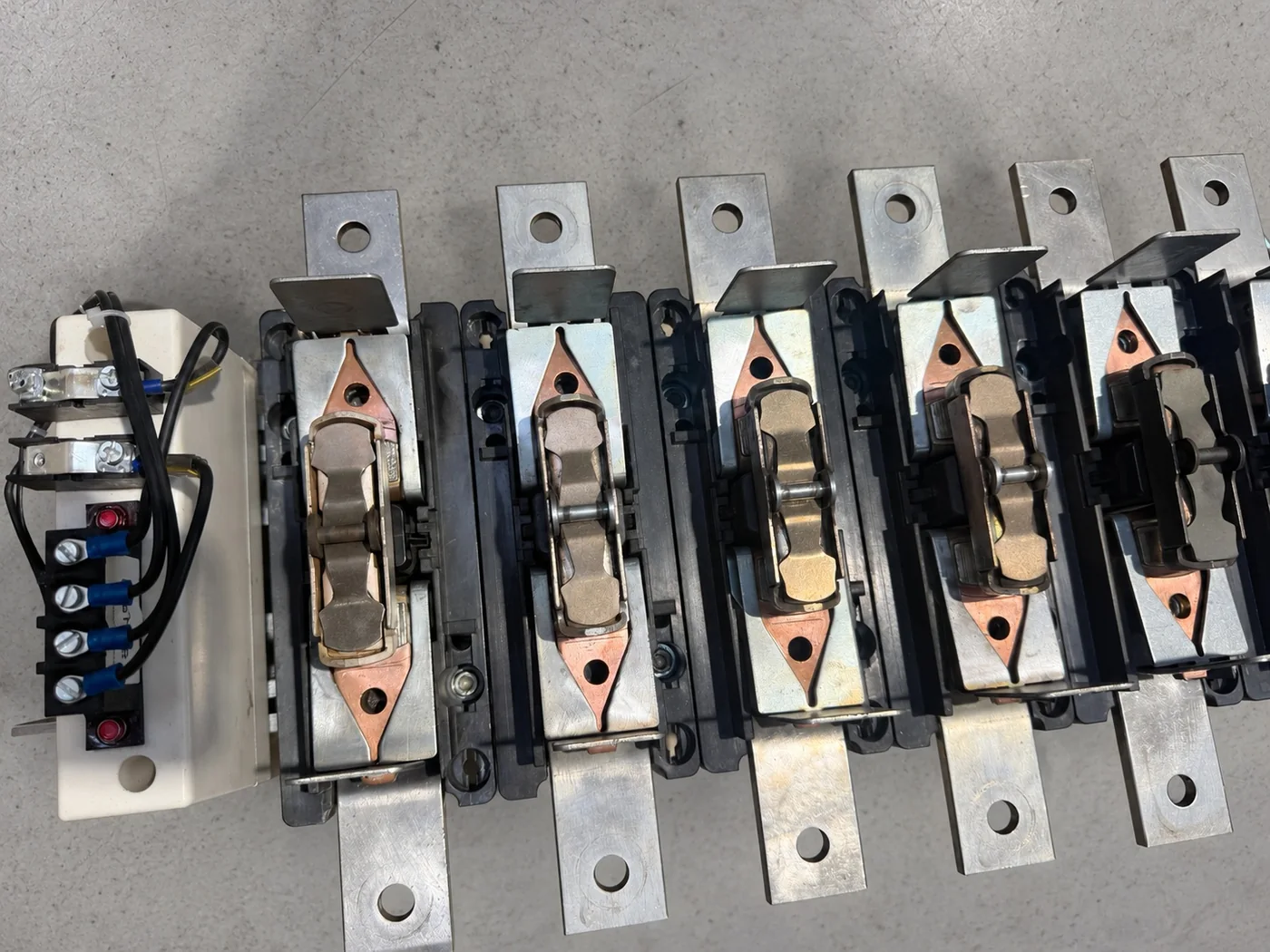 The same LC1F pole assemblies after restoration: contacts separated, re-plated and bright, mouldings clean